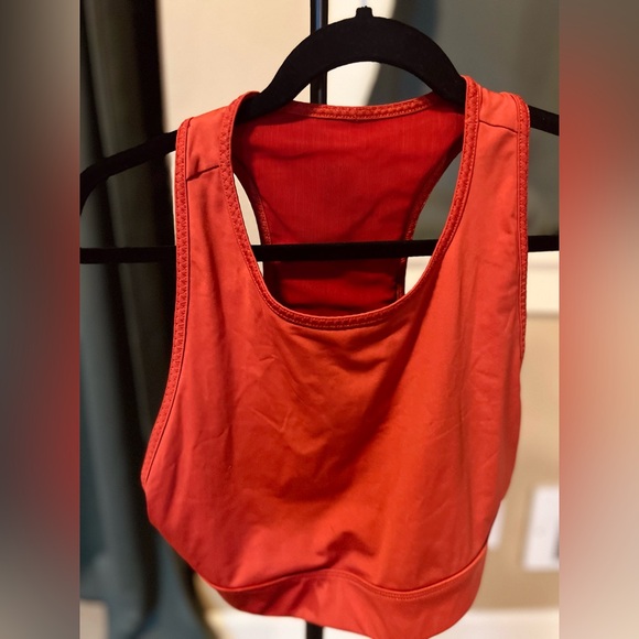 Burnt orange sports bra with phone pocket in the back. - Picture 2 of 4
